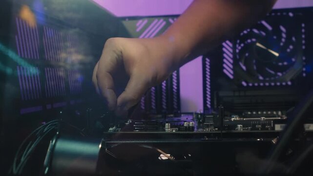 Connecting front panel cables to the motherboard including USB wires, power and reset buttons, headphone and microphone audio jacks
