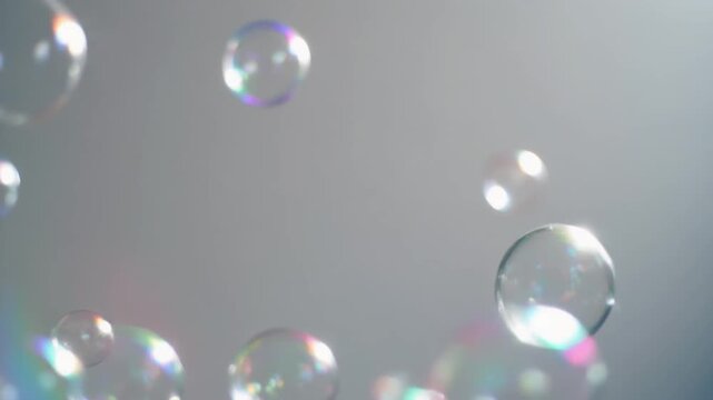 4K video of floating bubbles with rainbow colors