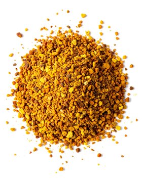 Overhead shot of a pile of small, irregular granules in shades of yellow and brown against a stark white background