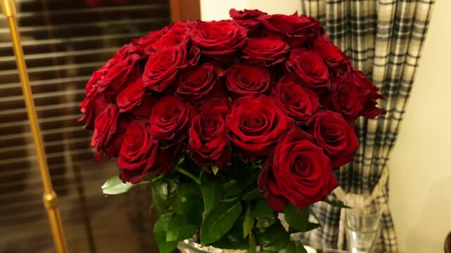 style elegant polish countryside interior detail bouquet deep red roses tightly arranged velvety petals glowing softly under warm up close drone poland flowers lighting mini rural home 