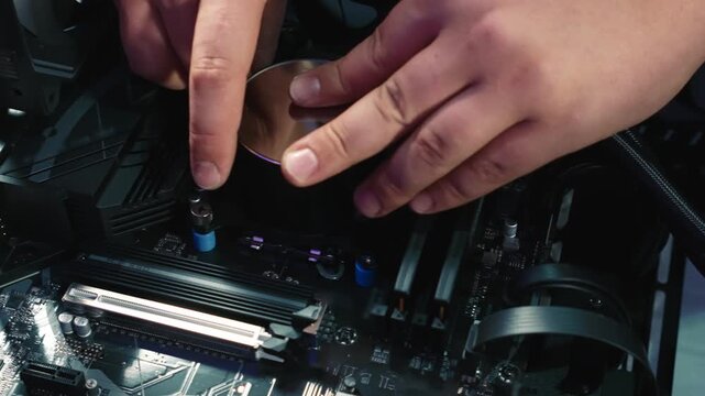 Installing round water block onto central processor for building water cooling system in desktop PC
