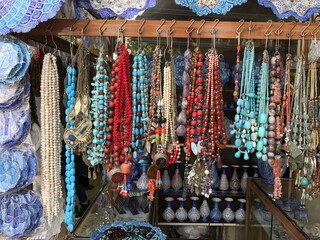 Fototapeta premium Colorful beaded necklaces in market stall