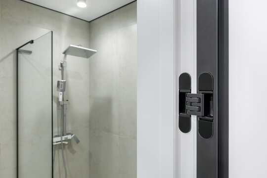 Close-up of Modern Hidden Door Hinge in Bathroom