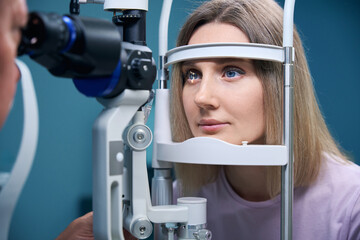 Female patient getting healthy visual refraction eye test at ophthalmologist clinic © Viacheslav Yakobchuk