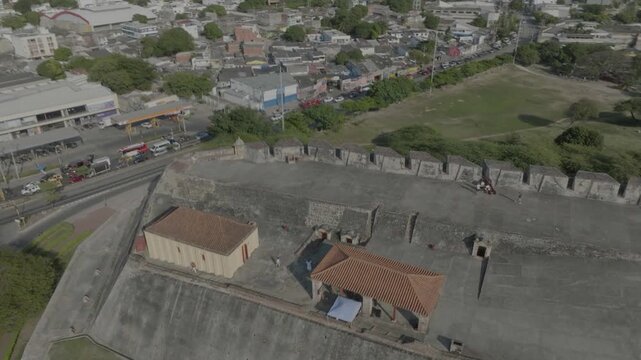 drone flying aropund west side of castillo de san felipe during the day going around the rest houses