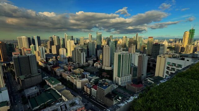 Wide shot of Makati urban skyline and high-rise buildings during daytime in Manila, Makati Philippines.