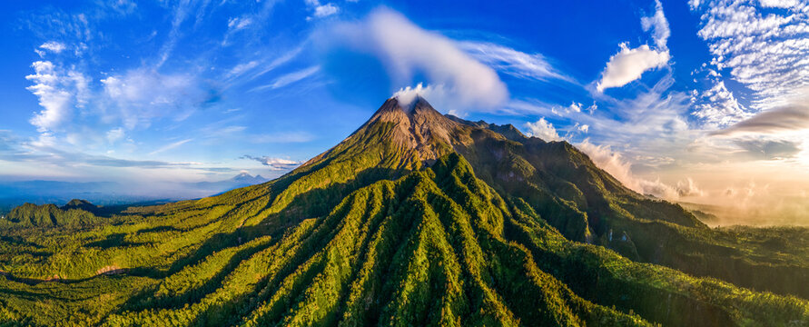Aerial Panorama of Mount Merapi Volcano Mountain in Golden Sunrise, Java, Indonesia