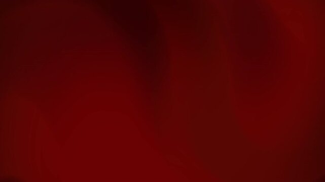 A dark red, textured abstract background viewed from a close-up perspective