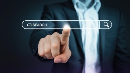 Businessman interacting with virtual search bar in futuristic blue lighting on dark background for technology