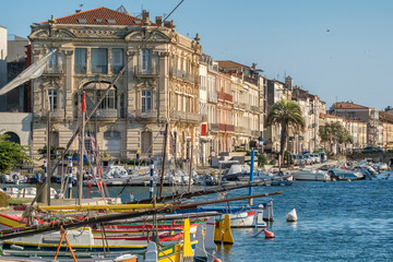 Colorful boats and historic waterfront architecture in Sete France