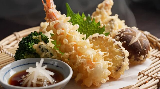 Assortment of freshly fried battered seafood and vegetables served with dipping sauce