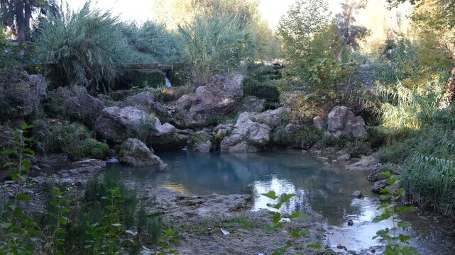 A small spring is flowing. Tarsus waterfall in autumn. Mersin, T&uuml;rkiye. 4k video 