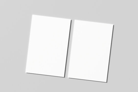 Blank white business card mockup with soft shadows isolated on a minimalist grey background. 3x2 inc