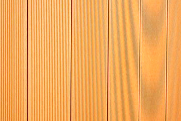 Fototapeta premium Warm Orange Wooden Panel Texture Background with Vertical Pattern