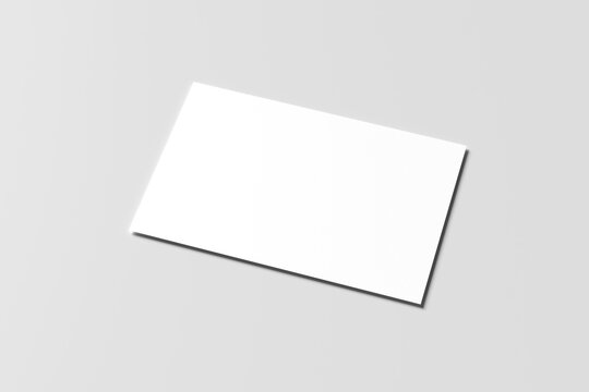Blank white business card mockup with soft shadows isolated on a minimalist grey background. 3x2 inc