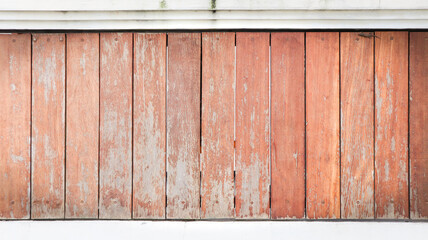 A weathered wooden wall with red paint peeling off, revealing a rustic texture, captured in a close-up view, similar to IMG_4415 scene © Belva