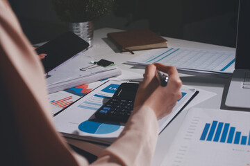 Fototapeta premium Above table with finance papers, graphs and big data during teamwork meeting with accounting or marketing team discussing budget, strategy or growth development. Closeup of SEO team doing research