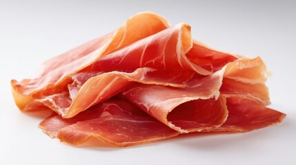 Slices of cured meat on a plain surface ready for serving or eating