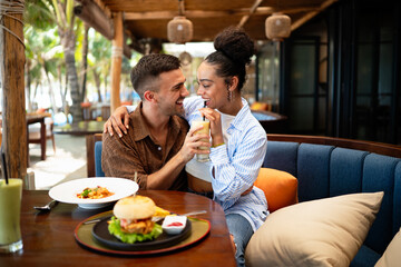 Adventurous couple enjoying exotic cuisine while traveling the world, embracing new cultures, food