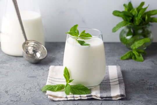 Glass cup of Turkish traditional drink ayran , kefir or buttermilk made from yogurt, healthy food
