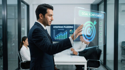 Obraz premium Business businessman office technology hologram goal achievement success strategy teamwork Confident businessman modern office interacting with hologram goal interface, showcasing goal achievement