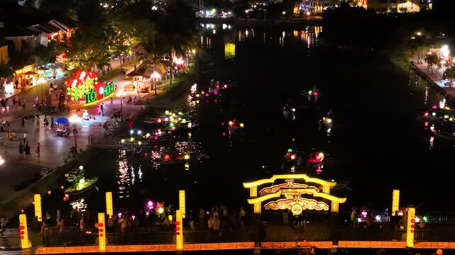 Magical Evening at Hoi An Lantern Festival on the Hoai River in Vietnam, Featuring Floating Paper Lanterns, Warm Glowing Lights, Traditional Vietnamese Houses, and a Cultural Celebration