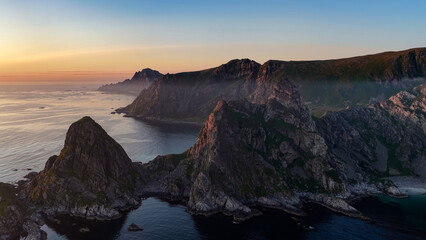 aerial, bird view amazing rock formations Laupen peak near Matind, Måtind mountain, Bleik on Vesterålen, vesteralen islands during midnight sun. Sunset in ocean, Beautiful hiking destination in arctic © Dirk
