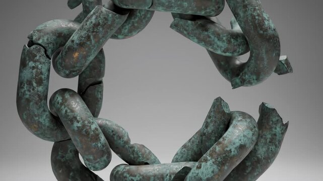 A broken patinated metal chain against a neutral gray backdrop showing fractured links and a corroded surface