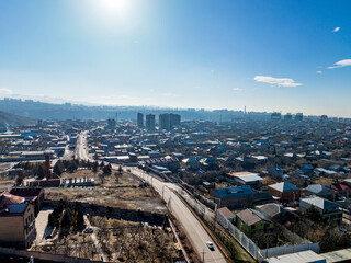 A cityscape with a large building in the background
