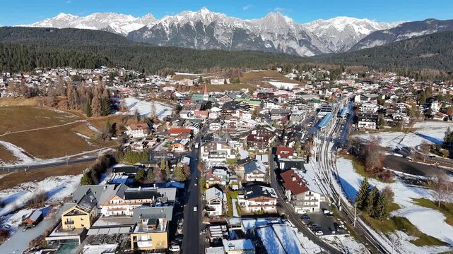 perspective sprawling alpine town seefeld tirol showcased dense tapestry traditional dark wood chalets white walled hotels town&rsquo;s architectural variety drone austria 