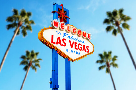 Welcome to Fabulous Las Vegas Sign With Plane Arriving. Logo Removed. The beautiful clear sky in the background.