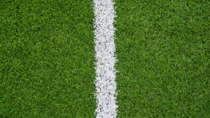 Fototapeta premium Green grass football field pitch with white boundary line