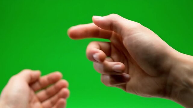Hands interacting with green screen background in dynamic video motion