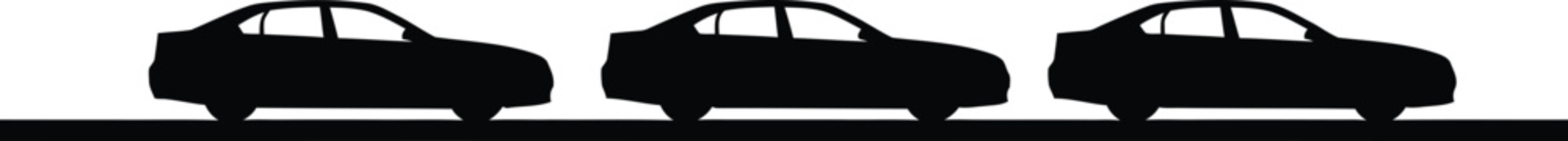 Black Cars Silhouettes Driving on Road at Night