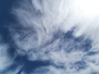 Obraz premium Blue Sky and White Clouds Over Mountains and Forest