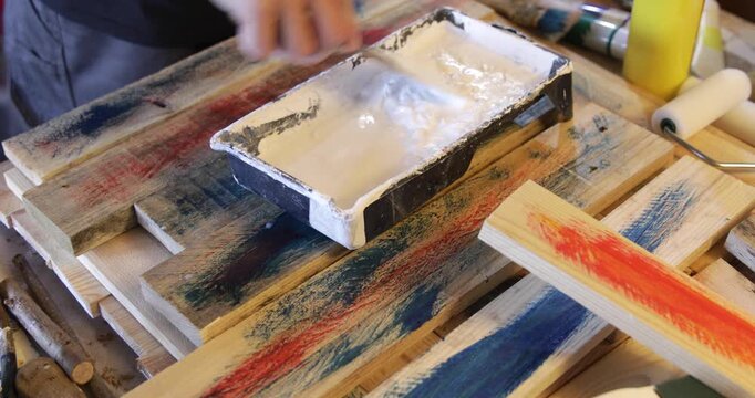 Water based acrylic protective primer coat thinned in plastic pot using spatula