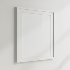 Blank white frame hangs on a wall in a well-lit room during the day next to a window with sunlight coming through