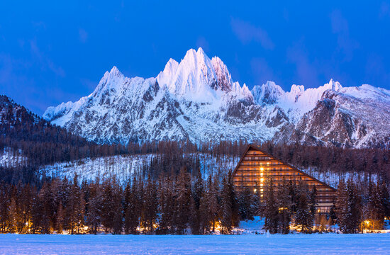 Kriv&aacute;ň mountain in the High Tatras, Slovakia, with a snow covered peak under a dramatic sky. Iconic alpine summit and national symbol surrounded by rugged mountain landscape, offering panoramic winter