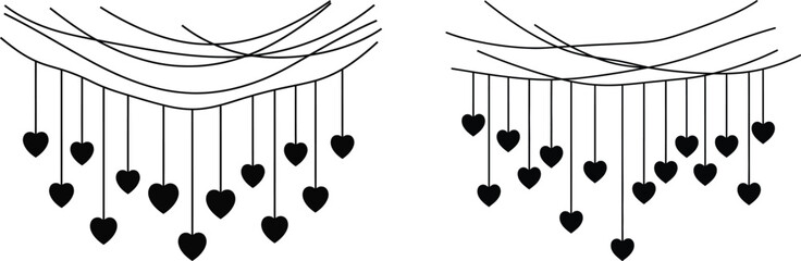 A pair of heart shaped wind chimes hanging side by side