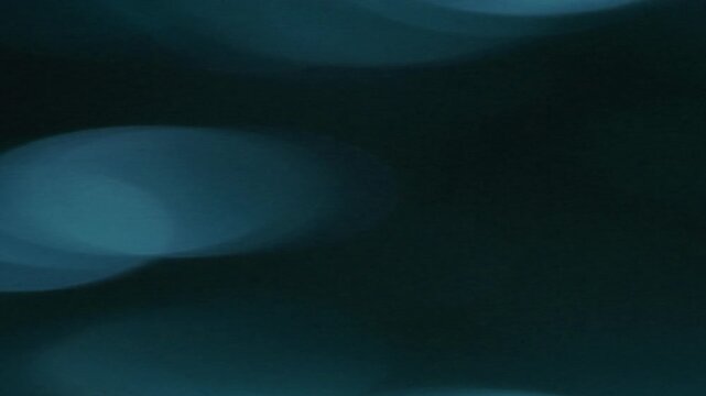 Dynamic Light Leak Bokeh Transition with soft blue circles against a dark background, perfect for intros and overlays.
