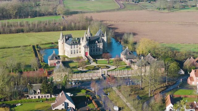 high perspective castle laarne&rsquo;s fortified complex architectural contrast between gray stone main angle drone view of laarne belgium red-brick outbuildings circular hedge 