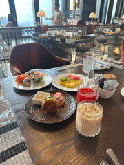 gourmet breakfast plates with coffee and juices