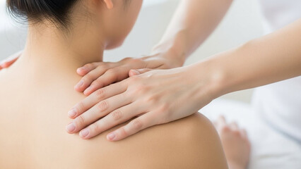 Fototapeta premium Close-up of a person receiving a shoulder massage for relaxation and therapy.