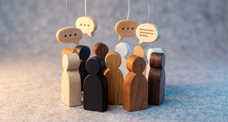 Diverse group of people icons in discussion with speech bubbles above them