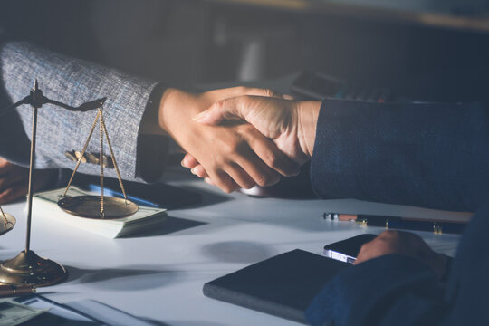 Businesswoman and Male lawyer or judge consult and conference having team meeting with client at law firm in office, Law and Legal services concept