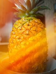 Juicy pineapple on the kitchen table background