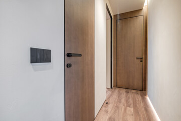long empty corridor in interior of entrance hall of modern apartments, office or clinic