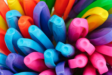 Bunch of bright, multi‑colored pens, pencils, or markers