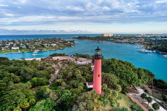 Aerial image of the Jupiter Island Lighthouse in Florida located at the confluence of the Indian and Loxahatchee rivers, and the inlet from the Atlantic Ocean