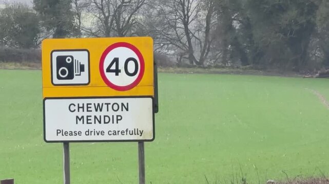 Roadside speed camera and forty mile speed limit sign for Chewton Mendip village in the English countryside
